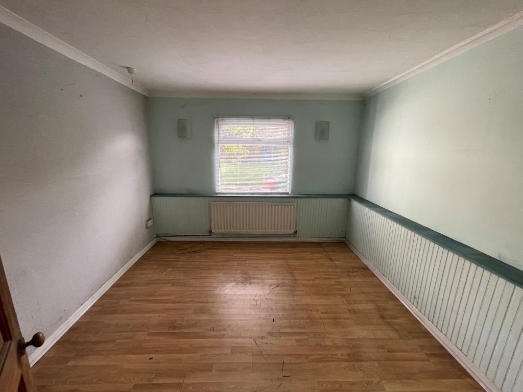Lot: 88 - FIRE-DAMAGED DETACHED BUNGALOW - Bedroom with window looking to garden